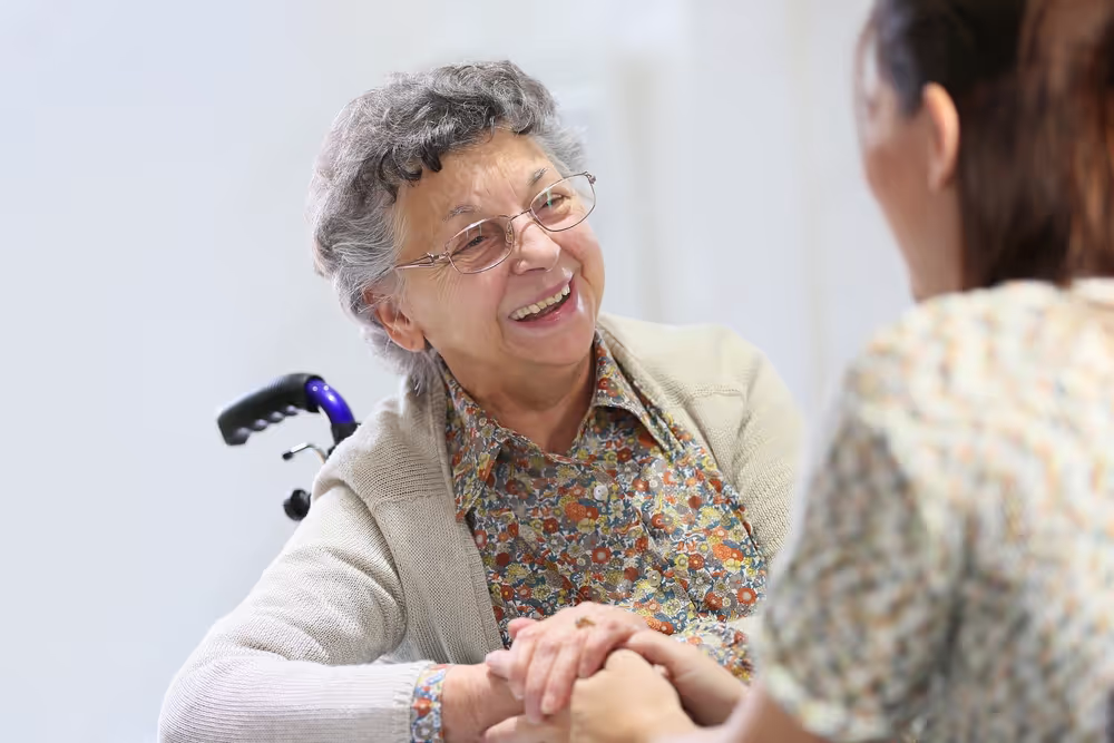 Carer assisting wheelchair user at Covista